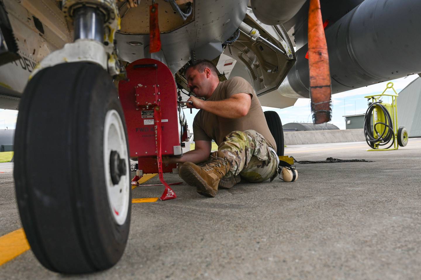 U.S. Air Force Tech. Sgt. Cody Bunderson, the 87th Electronic Warfare Squadron Combat Shield flight chief, works on a F-16 Fighting Falcon at Misawa Air Base, Japan, on Aug. 8, 2023.