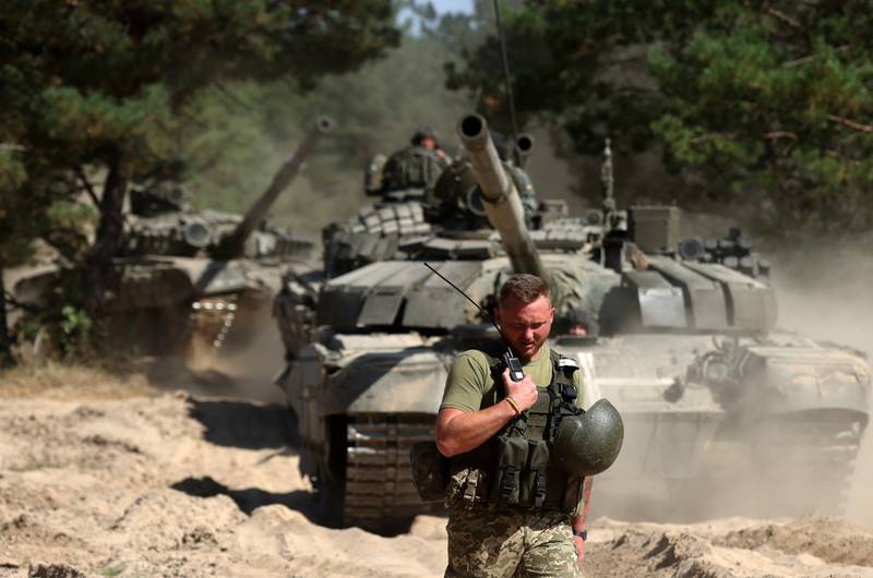A Ukrainian serviceman talks on the radio during a tank training exercise in the Chernigiv region on Sept. 8, 2023, amid the Russian invasion of Ukraine.