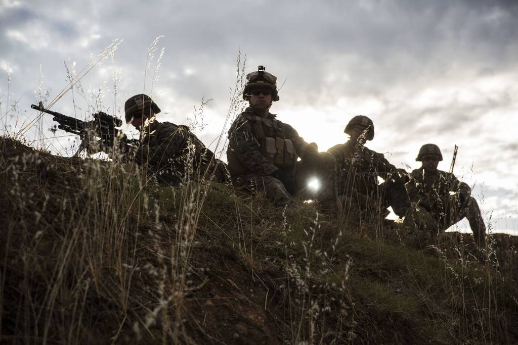 Marines with Special Purpose Marine Air-Ground Task Force-Crisis Response-Africa 19.2, Marine Forces Europe and Africa, prepare to fire their M240B machine guns during a squad attack on Campo De Maniobras, Base General Menacho, Spain
