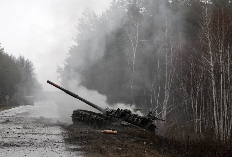 Smoke billows from a Russian tank destroyed by Ukrainian forces in the Lugansk region on Feb. 26, 2022.