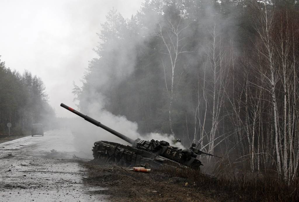 Smoke billows from a Russian tank destroyed by Ukrainian forces in the Lugansk region on Feb. 26, 2022.