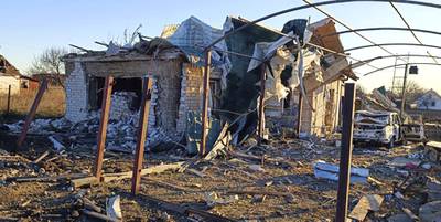 In this photo provided by the Zaporizhzhia region military administration, a damaged building and a car are seen after a Russian strike in the village of Novosofiivka, in the Zaporizhzhia region, Ukraine, Monday, Dec. 5, 2022.