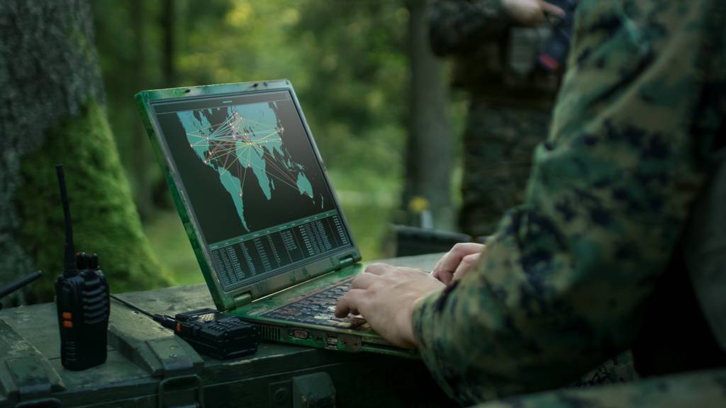 Military laptop hands typing