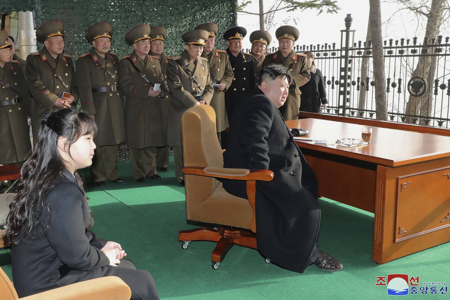 In this photo provided by the North Korean government, North Korean leader Kim Jong Un, with his daughter, inspects what it says is an artillery drill at an undisclosed location in North Korea, Thursday, March 9, 2023.