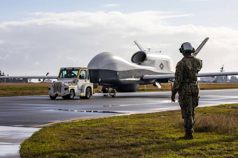 An MQ-4C Triton unmanned aircraft system taxis across the flight line at Naval Station Mayport, Florida, on Dec. 16, 2021.