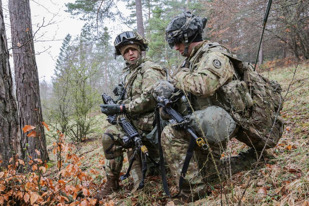 U.S. Army soldiers listen to a radio call during Dragoon Ready 21 at the Hohenfels Training Area in Germany on April 12, 2021.
