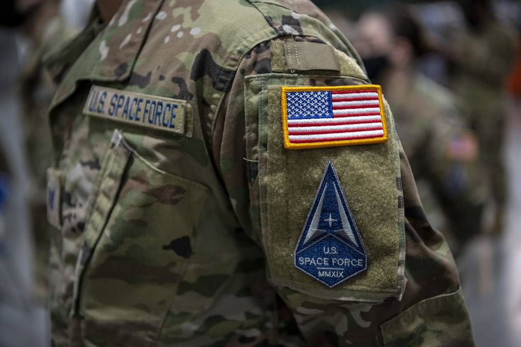 U.S. airmen assigned to Travis Air Force Base, Calif., transition into the U.S. Space Force during a ceremony at the 621st Contingency Response Wing, Feb. 12, 2021