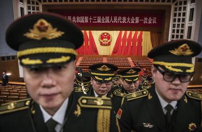 Members of a band from the People's Liberation Army leave following a speech by Chinese President Xi Jinping after the closing session of the National People's Congress at The Great Hall Of The People on March 20, 2018.