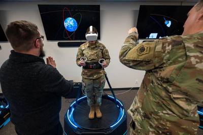 Maj. Chelsea Hatch, aide-de-camp at Space Training and Readiness Command, participates in a hands-on demonstration of a virtual reality immersion set inside the 'Innovation Lab' at the National Security Space Institute–West campus, Colorado Springs, Colo., Nov. 8, 2022. The NSSI-West celebrated its formal opening by holding a ribbon-cutting ceremony followed by a tour of the facility and a hands-on demonstration of education technologies. (Ethan Johnson/Space Force)