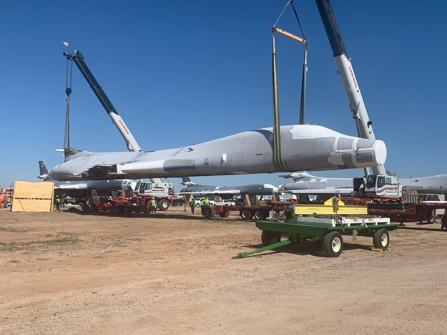 B-1B Lancer tail number 85-0092 is lifted and placed on flatbed trailers for the 1,000-mile journey to Wichita, Kan., April 24, 2020. The National Institute for Aviation Research at Wichita State University will scan every part of the aircraft to create a digital twin that can be used for research. (U.S. Air Force photo by Daryl Mayer)