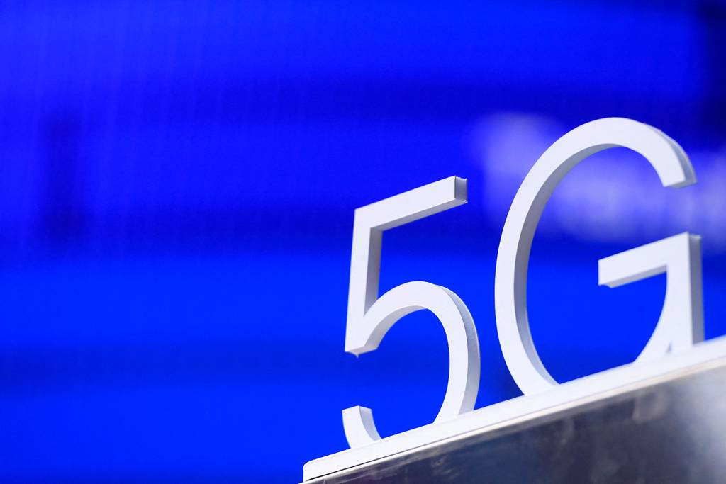 A 5G hotspot sign is displayed at the MWC in Barcelona on March 2, 2022.