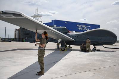 Airmen assigned to the 319th Aircraft Maintenance Squadron perform a maintenance check June 6, 2022, on an RQ-4 Block 30 Global Hawk remotely piloted aircraft at Grand Sky on Grand Forks Air Force Base, North Dakota. The aircraft will be used at the Test Resource Management Center’s High Speed System Test Department. Grand Sky is a business and aviation park at Grand Forks focused on developing and growing the unmanned aerial systems industry. (Senior Airman Ashley Richards/Air Force)