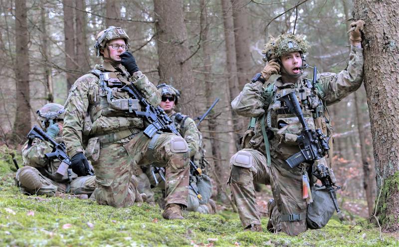 U.S. Army Soldiers with the 2nd Cavalry Regiment are pictured during Dragoon Ready 2023. They are using integrated tactical network capabilities, which include radios.