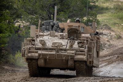 Soldiers drive through a low-water crossing in the Armored Multi-Purpose Vehicle, or AMPV, after completing field testing on Fort Hood, Texas.