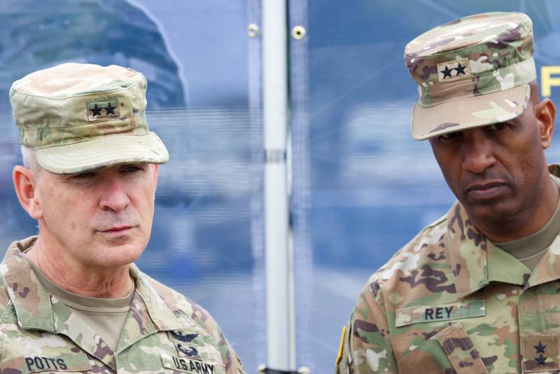 U.S. Army Maj. Gens. Anthony Potts, with the Program Executive Office for Command Control and Communications-Tactical, and Jeth Rey, the director of the Network Cross-Functional Team, listen to questions from reporters at Fort Myer, Virginia, on May 4, 2023.
