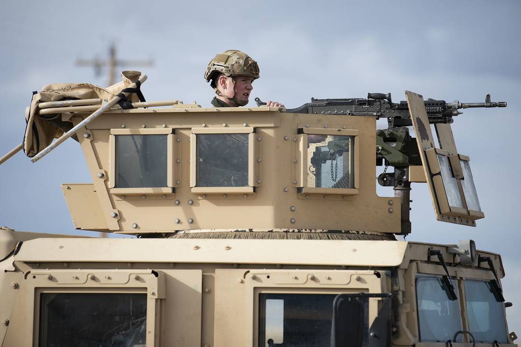 Airman 1st Class Christopher Crocker provides security from a turret of a Humvee during an exercise at a launch facility, March 19, 2021, near Malmstrom Air Force Base, Montana.