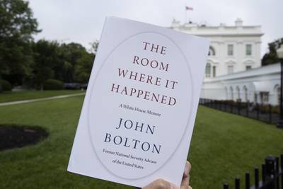 A copy of "The Room Where It Happened" is photographed at the White House in Washington.