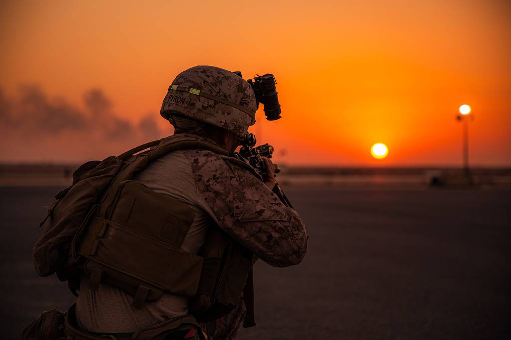 A U.S. Marine with 3rd Battalion, 1st Marine Regiment, assigned to the Special Purpose Marine-Air Ground Task Force – Crisis Response - Central Command, sets security around an MV-22 Osprey during aerial embarkation drills in Kuwait, Oct 22, 2020