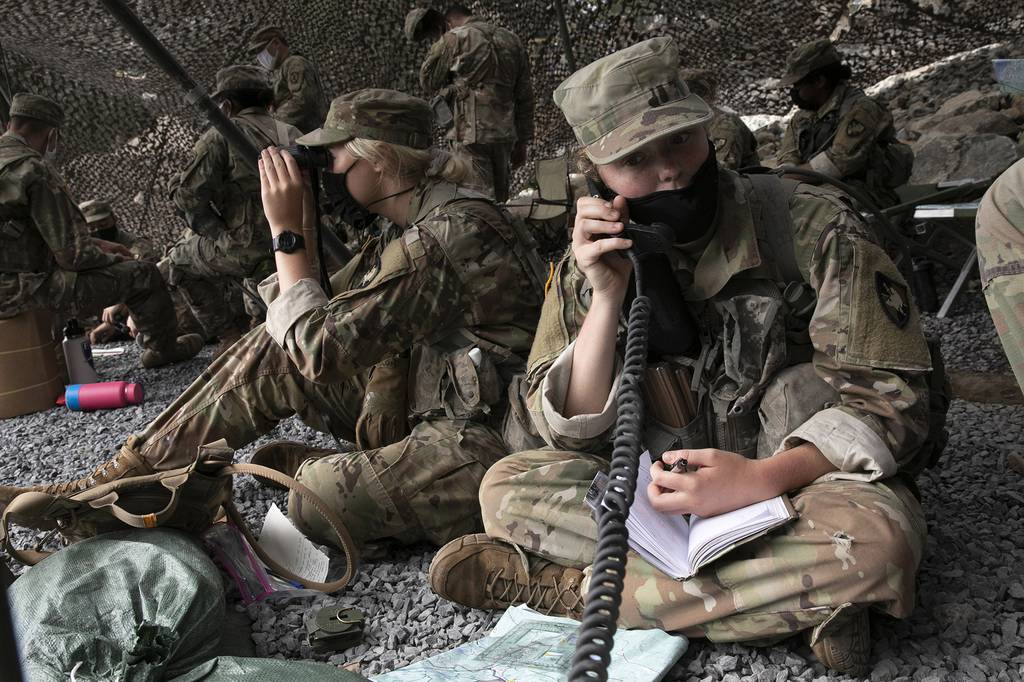 A cadet uses a field radio to call in live fire coordinates, Friday, Aug. 7, 2020, in West Point, N.Y.