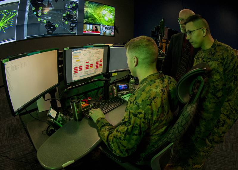 In this 2020 photo illustration, Marines with U.S. Marine Corps Forces Cyberspace Command are seen in an operations center at Lasswell Hall at Fort Meade, Maryland.