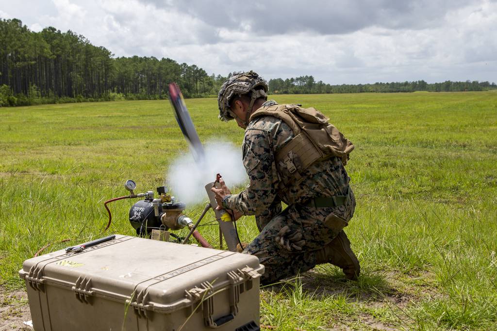 U.S. Marine Corps Lance Cpl. Isiah Enriquez launches a Switchblade drone during a training exercise at Camp Lejeune, North Carolina, in 2021.