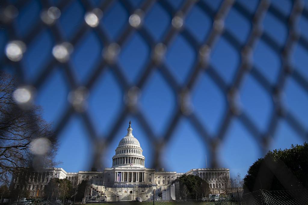The U.S. Capitol is seen behind security fencing on Jan. 9, 2021, in Washington.